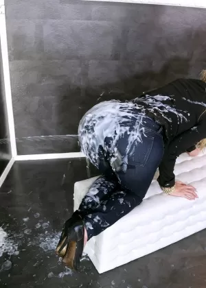 Blonde chick gets soaked from head to toe in jizz at a gloryhole