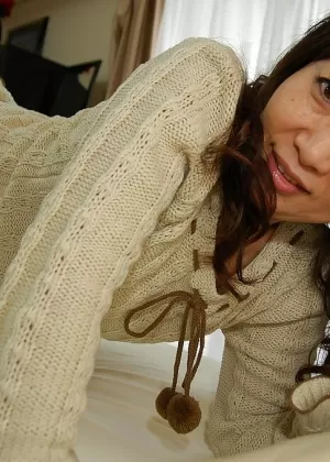 Asian lady in pantyhose Yukiko Moritani undressing and posing on the couch