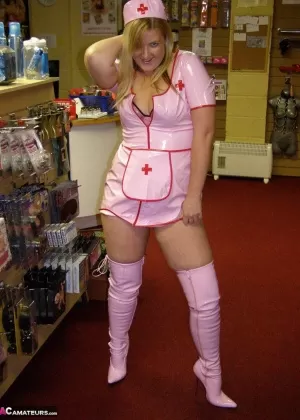 Blonde amateur Samantha works free of a latex nurse outfit in a sex shoppe