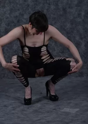 Amateur model plays with her nipples while wearing a revealing stocking