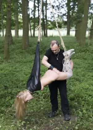 Blonde girl Candee Licious sucks a cock after being caned during BDSM action