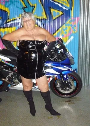 Old fatty Grandma Libby strips to black boots on top of a motorcycle