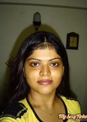 Indian girl Heha puts a smile on her pretty face during non nude poses