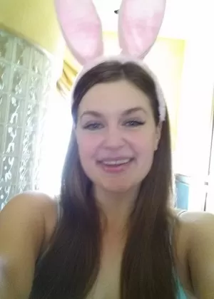 Plump amateur Danielle takes topless and clothed selfies around the house