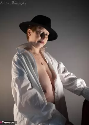 Mature BBW Posh Sophia exposes her huge boobs and pussy in OTK boots