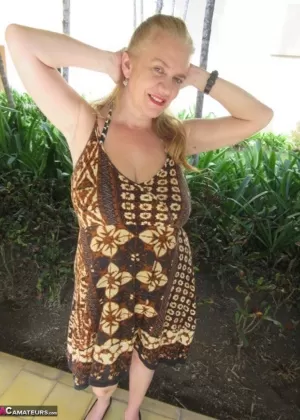 Mature older Lily May flaunts big saggy tits in casual evening and beach wear