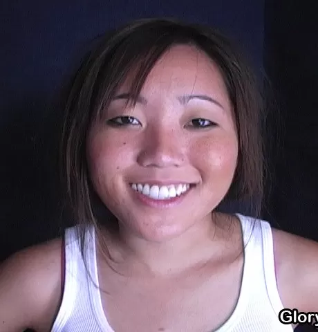 Asian teen gives interracial gloryhole blowjob