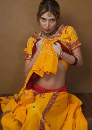 Indian amateur works free of traditional clothing for a nude shoot