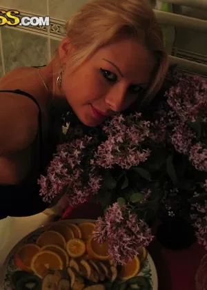 Blond amateur Adele models lingerie inside before showing tits and ass outside