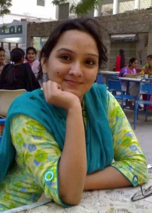 Overweight Indian student shows her bare mid-section in a brassiere