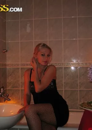 Blond amateur Adele models lingerie inside before showing tits and ass outside