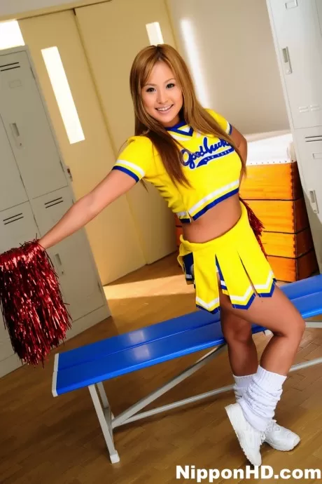 Adorable Japanese cheerleader uncovers great tits before showing her pussy