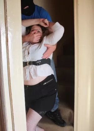 Fat woman is rendered helpless by the maintenance man before being tied up